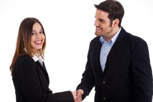 Business man welcoming a women by shake hands